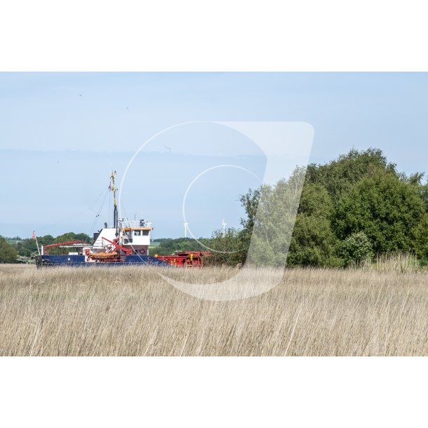 Fragtskib p vej fra Randers igennem Randers Fjord