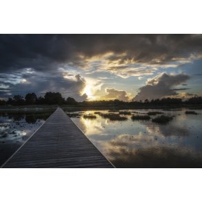 Solnedgang over badebro og sommerhus omr�de i �ster Hurup